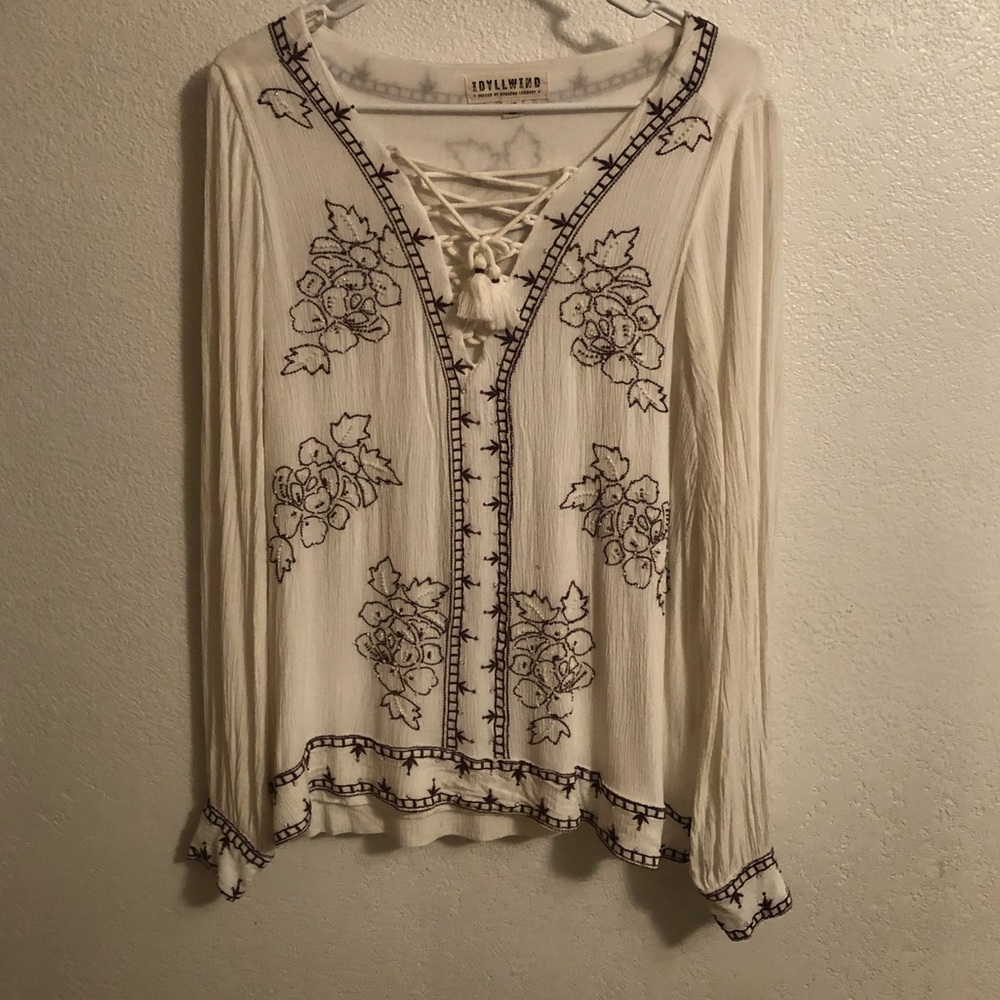 This is a hand beaded blouse from Idyllwind size large.